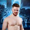 Francesco Akira subisce una Hurricanrana dall'arbitro